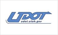 A blue and white logo for udot.