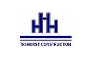 A blue and white logo of a construction company.